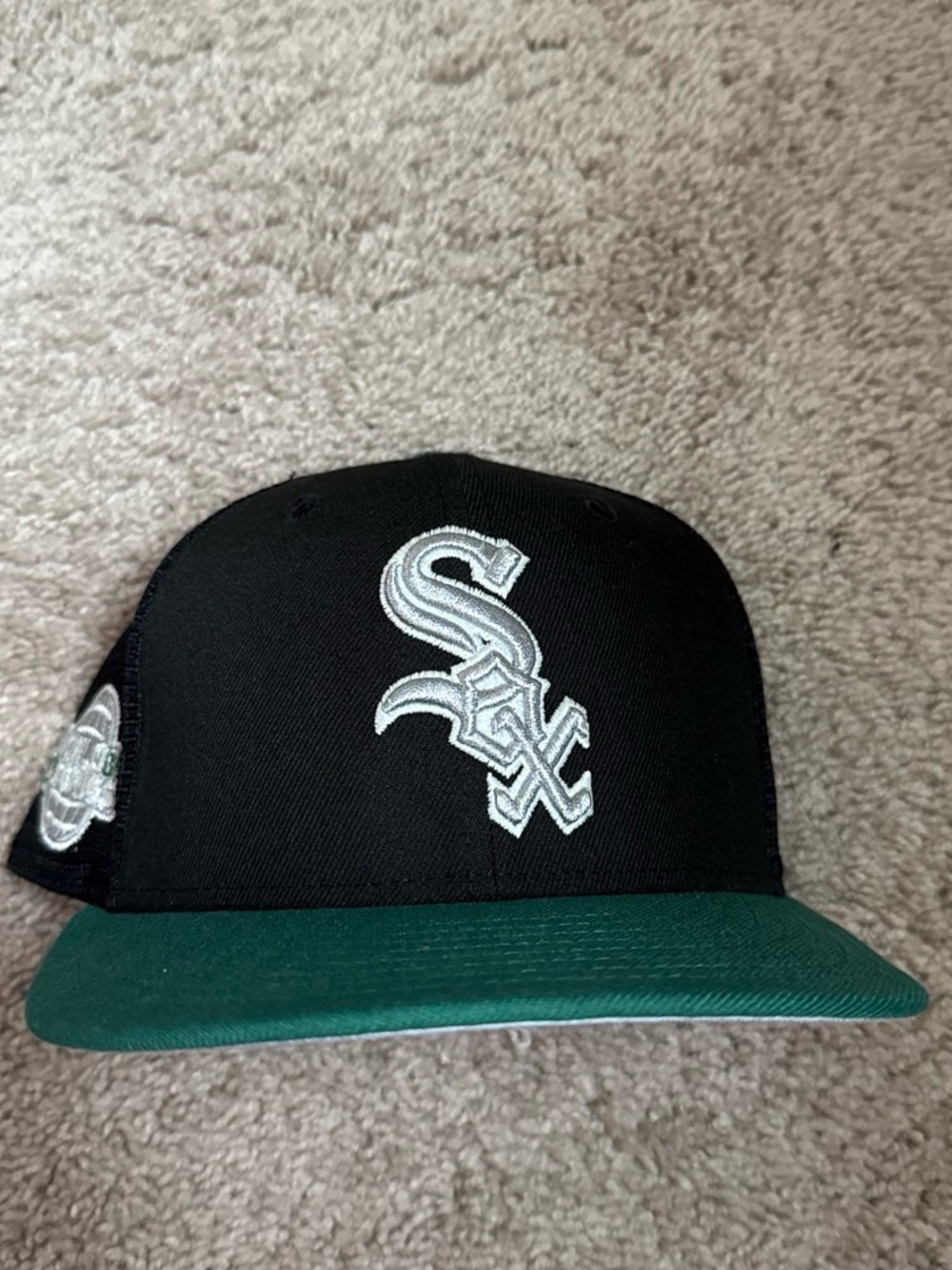 New Era Black and Green Snapback Hat with White Embroidered Logo